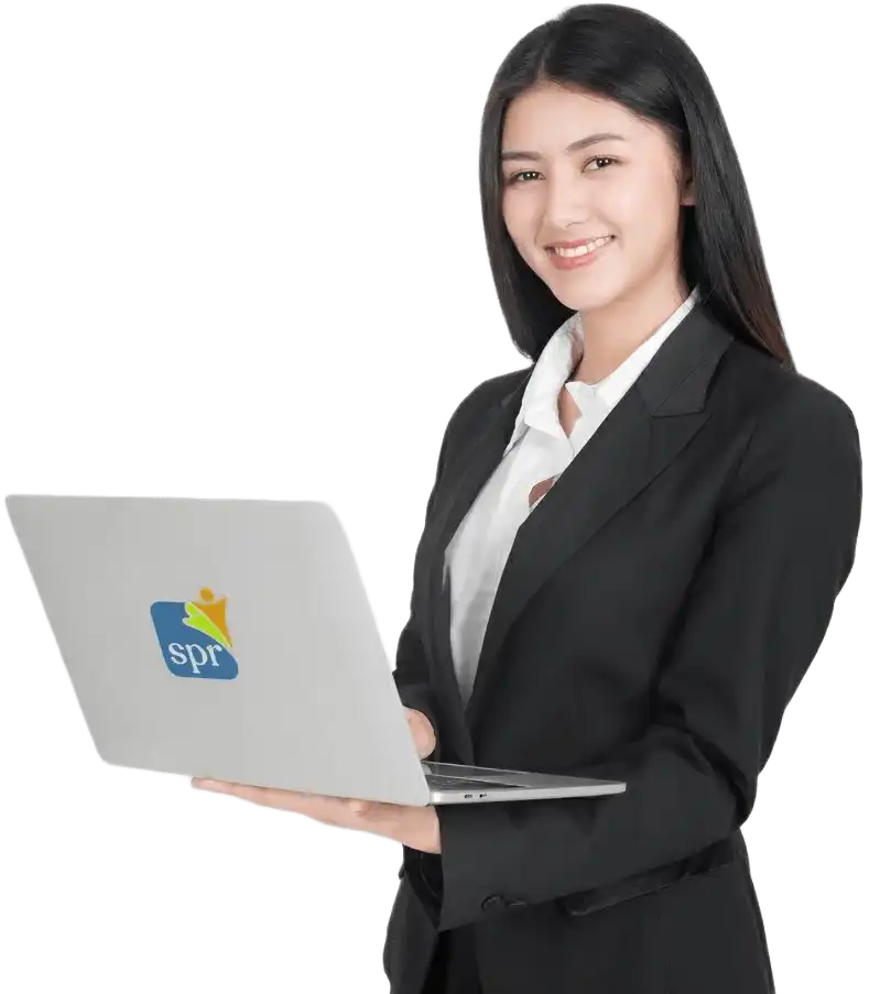Smiling staffing specialist working on laptop with SPR logo for Search Party Recruiting solutions