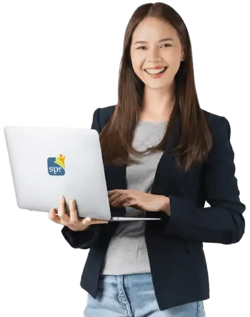 Remote staffing specialist working on laptop with SPR logo for Search Party Recruiting services