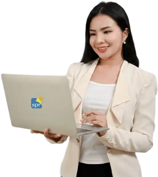 Smiling professional woman using a laptop with the Search Party Recruiting logo, representing virtual staffing services