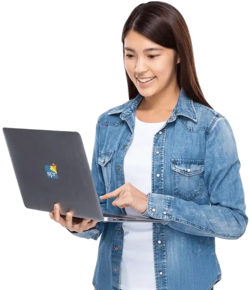 Woman in denim jacket working on laptop with SPR logo for Search Party Recruiting&rsquo;s virtual hiring solutions