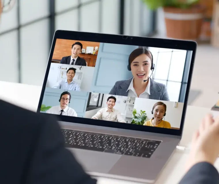 Young Asian businessman work at home and virtual video conference meeting with colleagues business people, online working, video call at home office